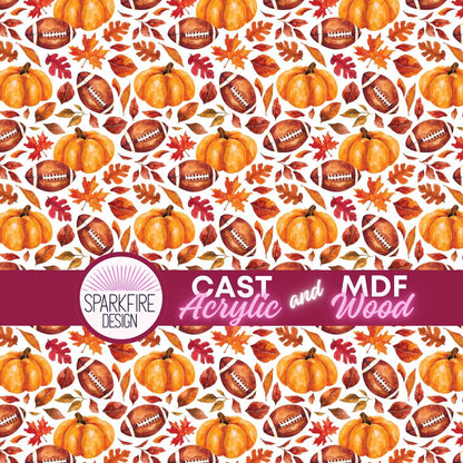 patterned acrylic  featuring orange pumpkins, brown footballs, and autumn leaves on a white background. patterned acrylic for laser cutting.  The acrylic is white cast acrylic.  Patternply acrylic.