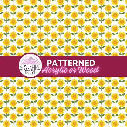a repeating pattern of yellow sunflowers on a white acrylic