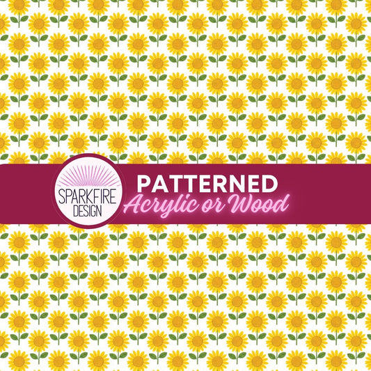 a repeating pattern of yellow sunflowers on a white acrylic