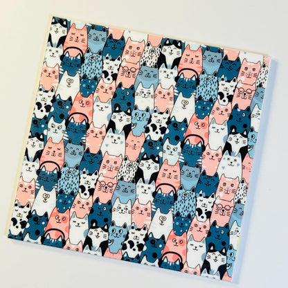 a picture of a bunch of cats on a sheet of paper