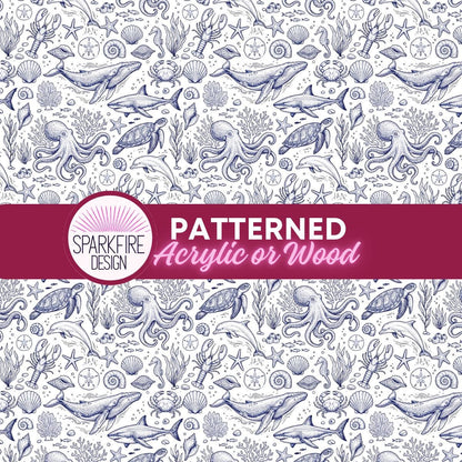a repeating pattern of various marine life elements, including fish, octopuses, and other sea creatures, all rendered in a detailed, hand-drawn style. The pattern is predominantly blue and white, with accents of red and green, creating a visually striking and intricate design. The text "PATTERNED Acrylic or Wood" is prominently displayed in the center of the image, indicating the type of material or medium used in the artwork.
